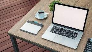 Computer with coffee cup, rebranding image